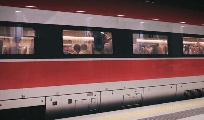 group of people inside red and gray train